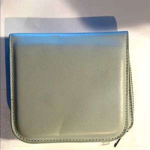 COS Leather light blue wallet. Holds change, bills, and credit cards.